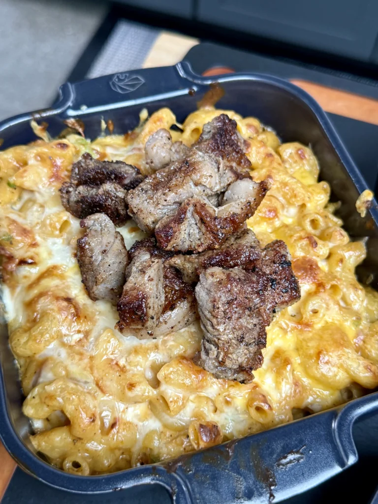 up close of the steak bites in the mac and cheese