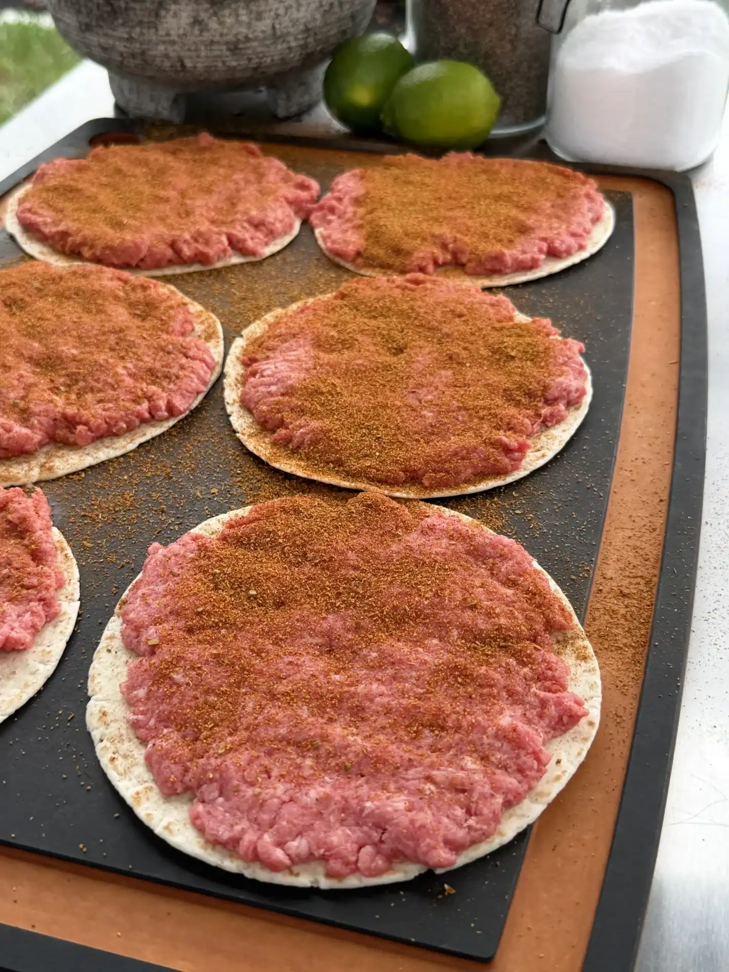 seasoned beef on the taco shells
