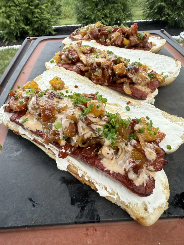 3 hot dogs on a cutting board