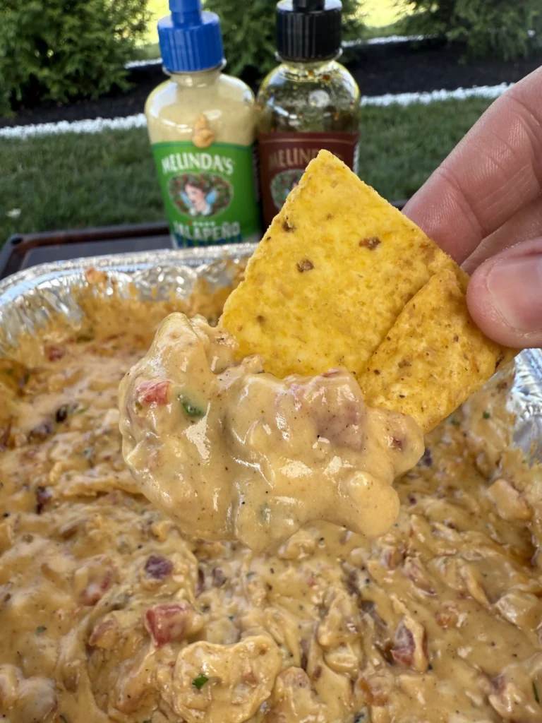 chicken bacon ranch queso with a chip inside 