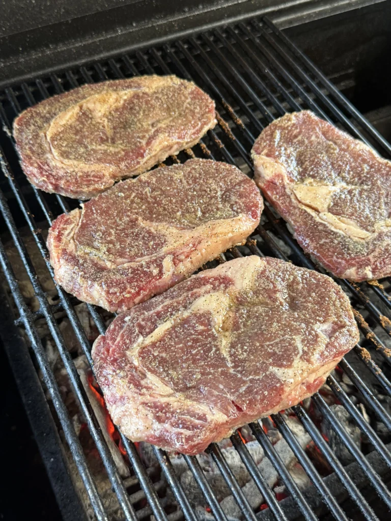 grilled ribeye steaks on the hasty bake