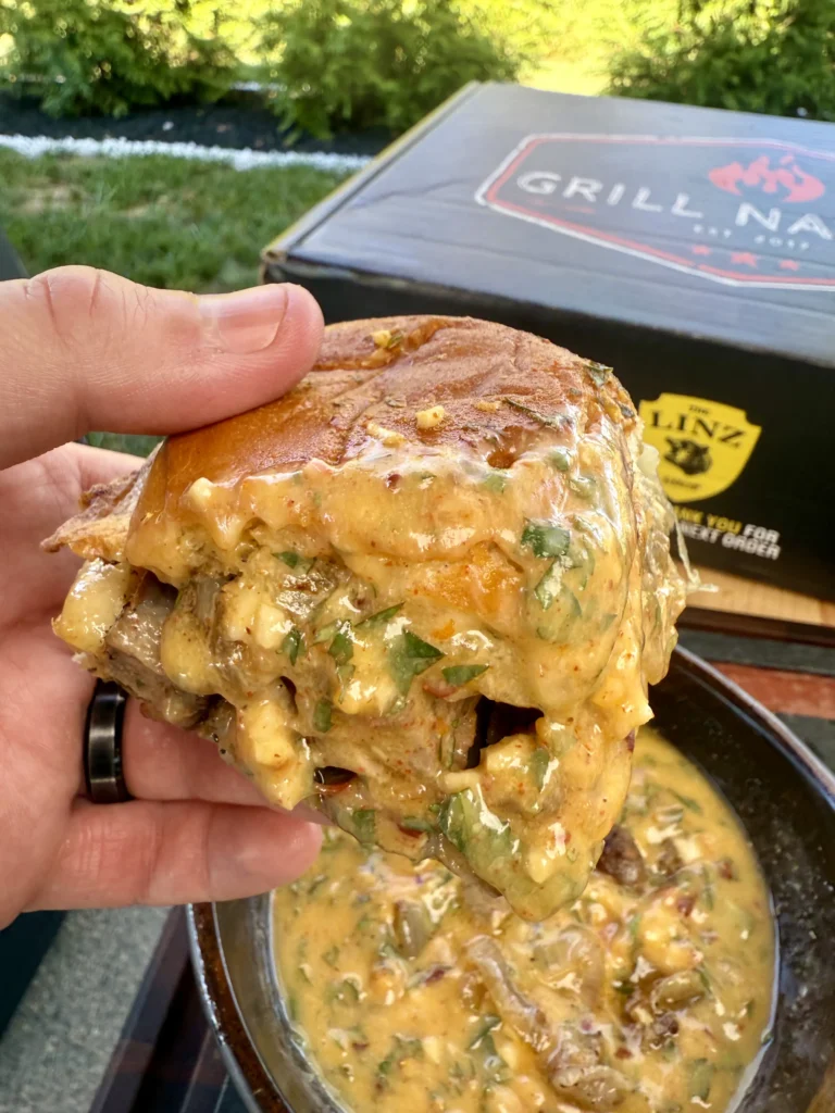 slider being dipped into the cowboy butter