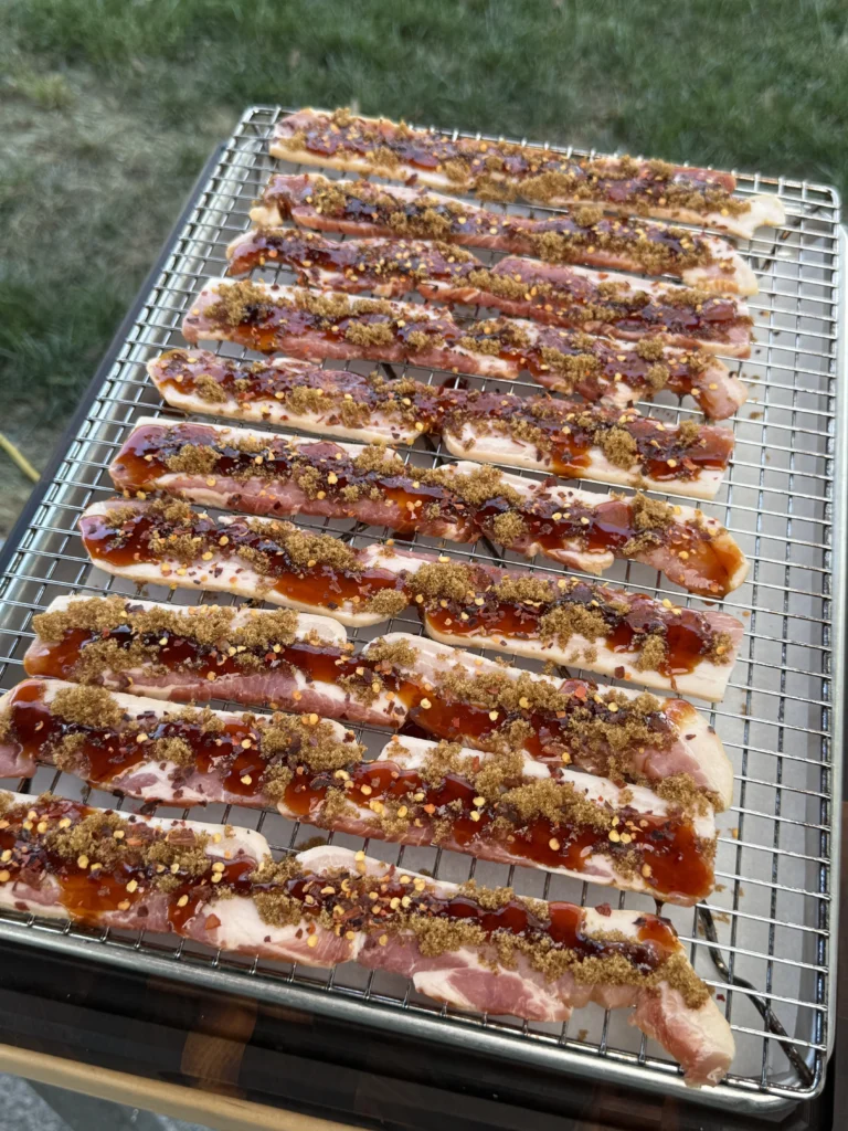 uncooked candied bacon on a rack