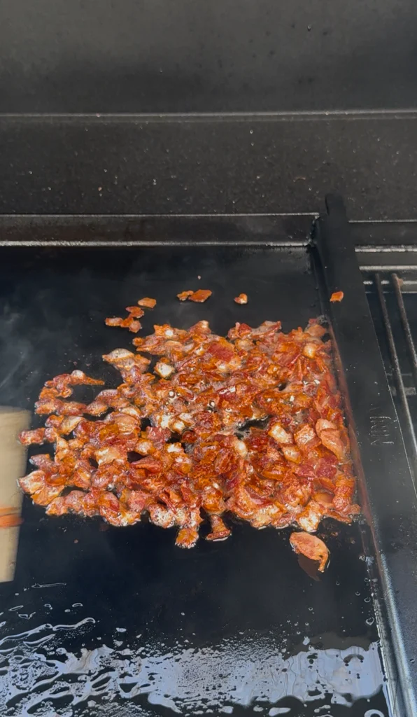 cooked bacon on the flat top