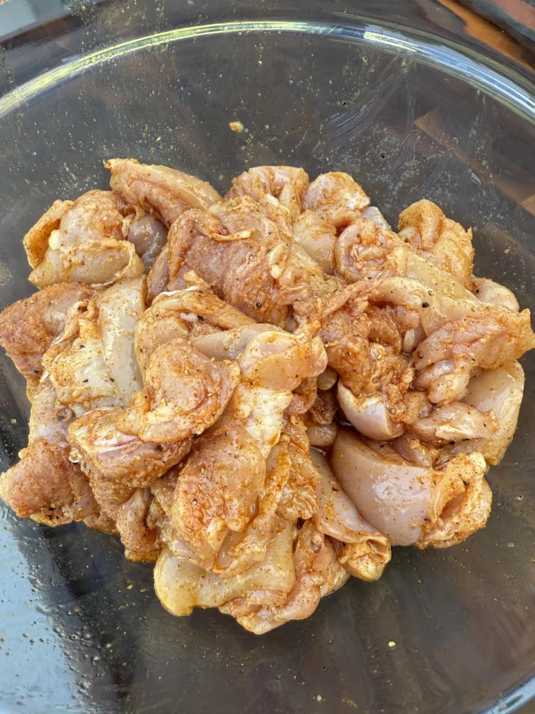 seasoned chicken thighs in a bowl