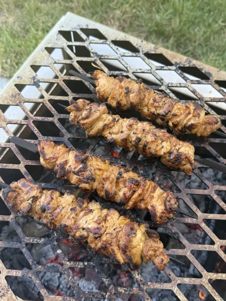 grilled chicken skewers on the grill