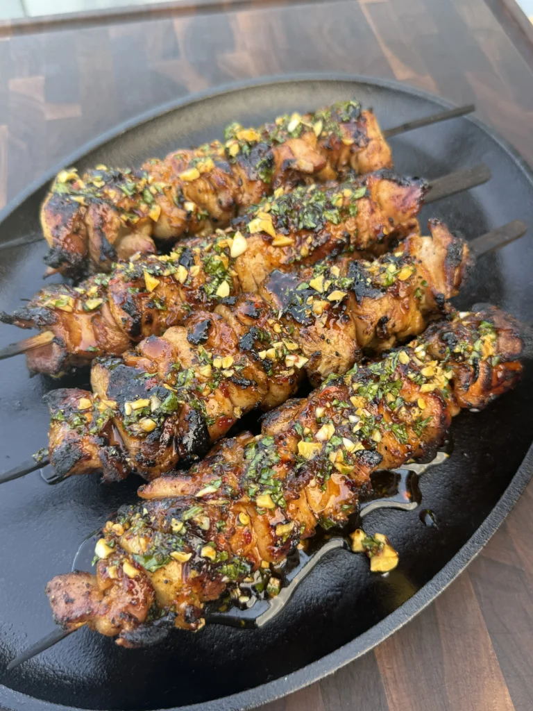 hot honey lemon chicken skewers on a plate