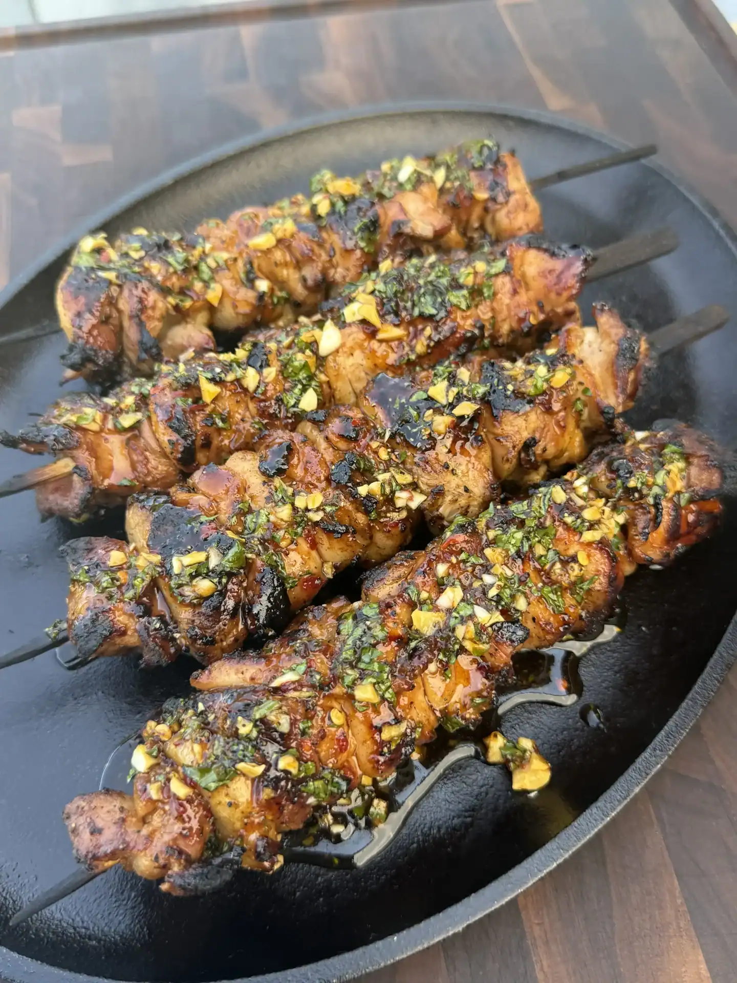 hot honey lemon chicken skewers on a plate