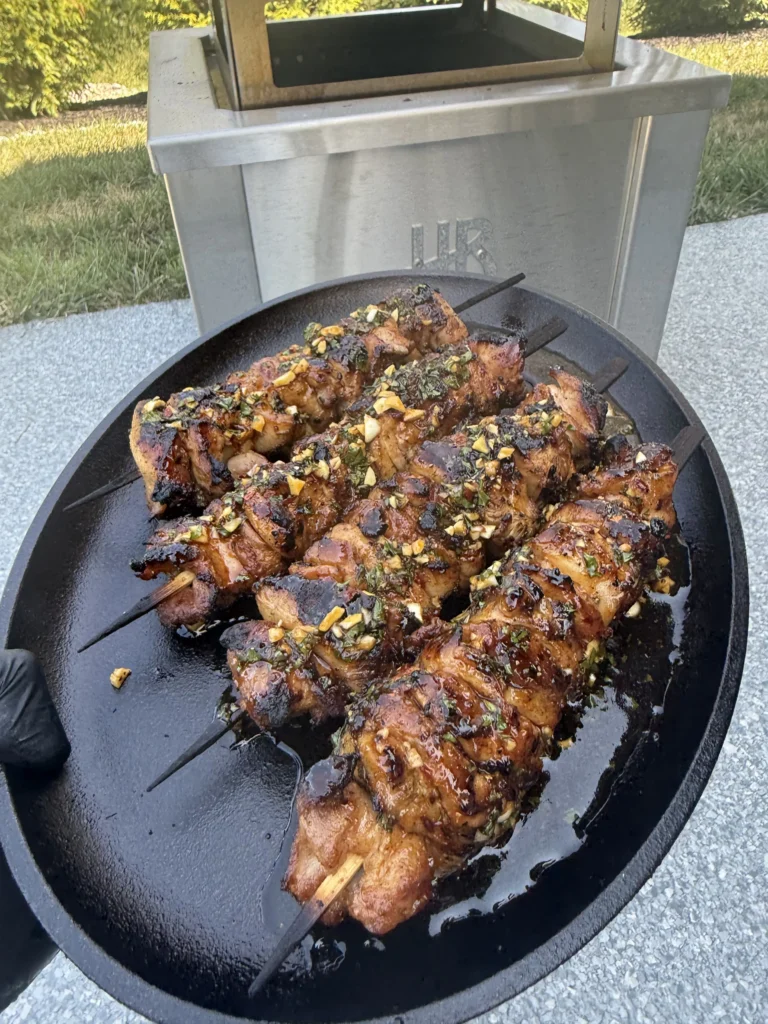 final shot of chicken on a plate with hasty bake in the background