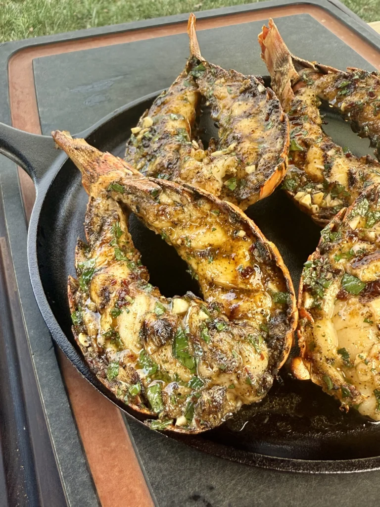 lobster tails garnished on a plate