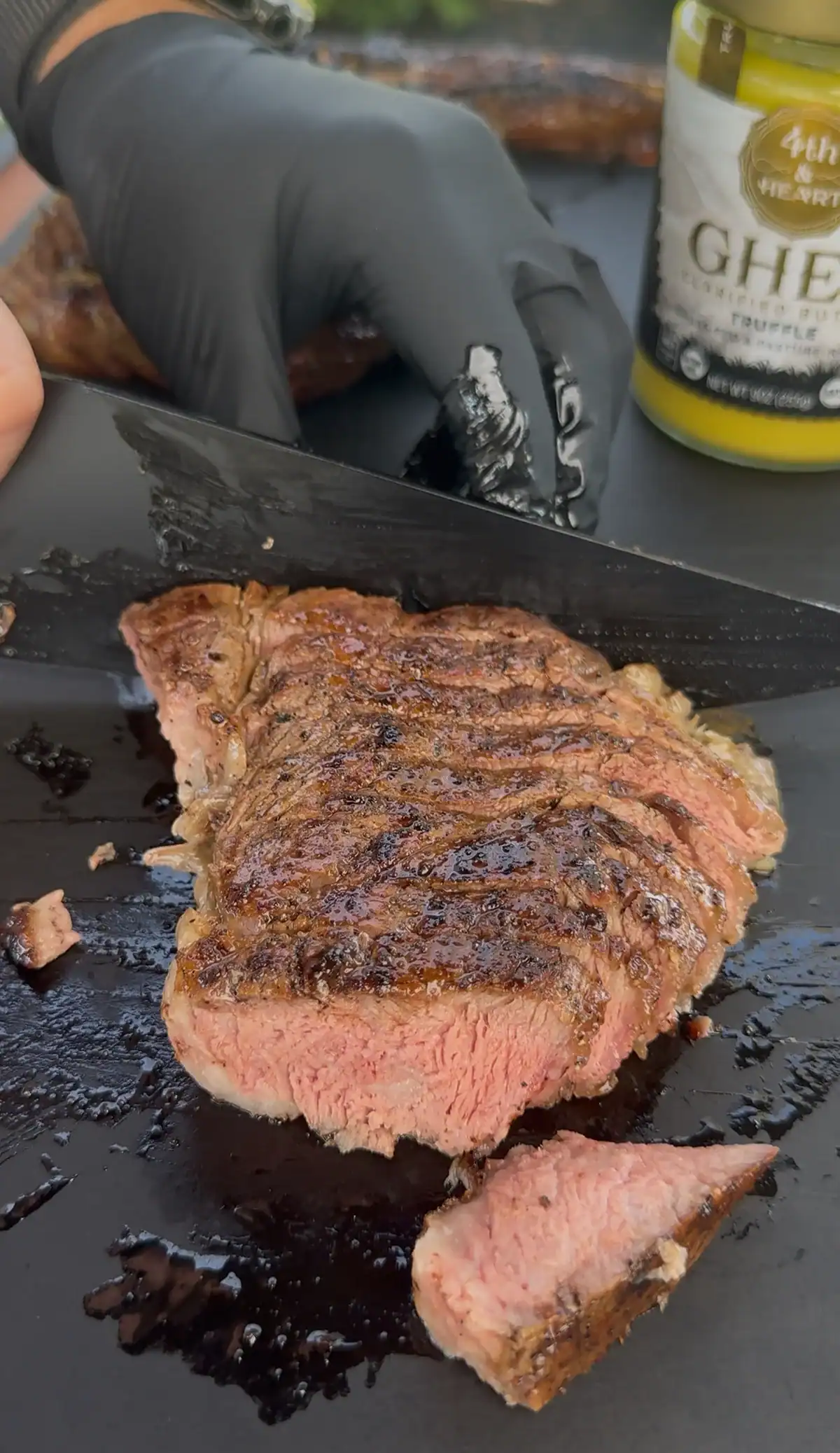 sliced ribeye steaks on the cutting board