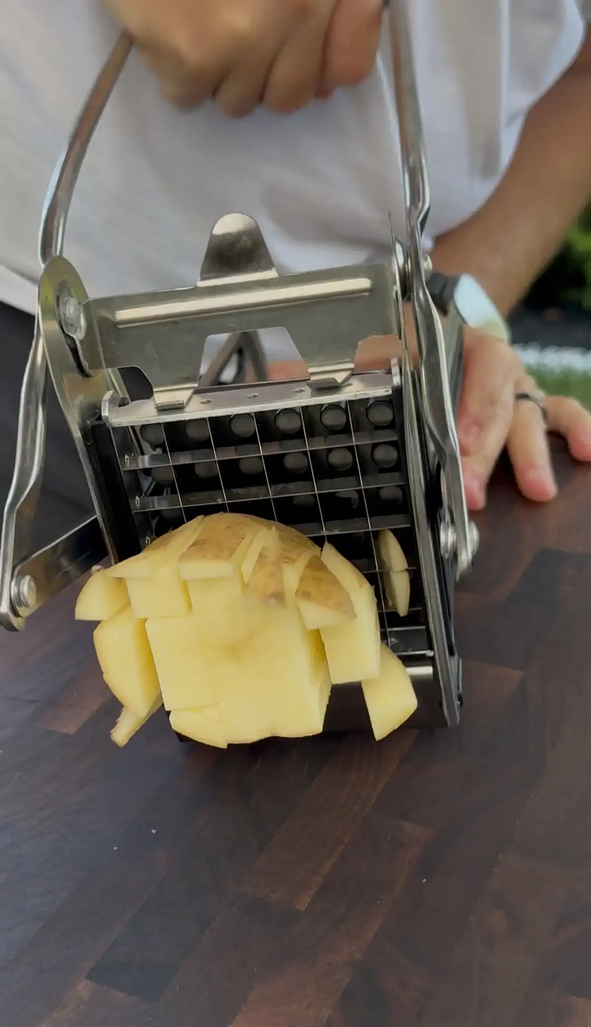 sliced potatoes on a wood cutting board