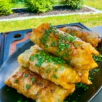 texas twinkie egg rolls on a black plate
