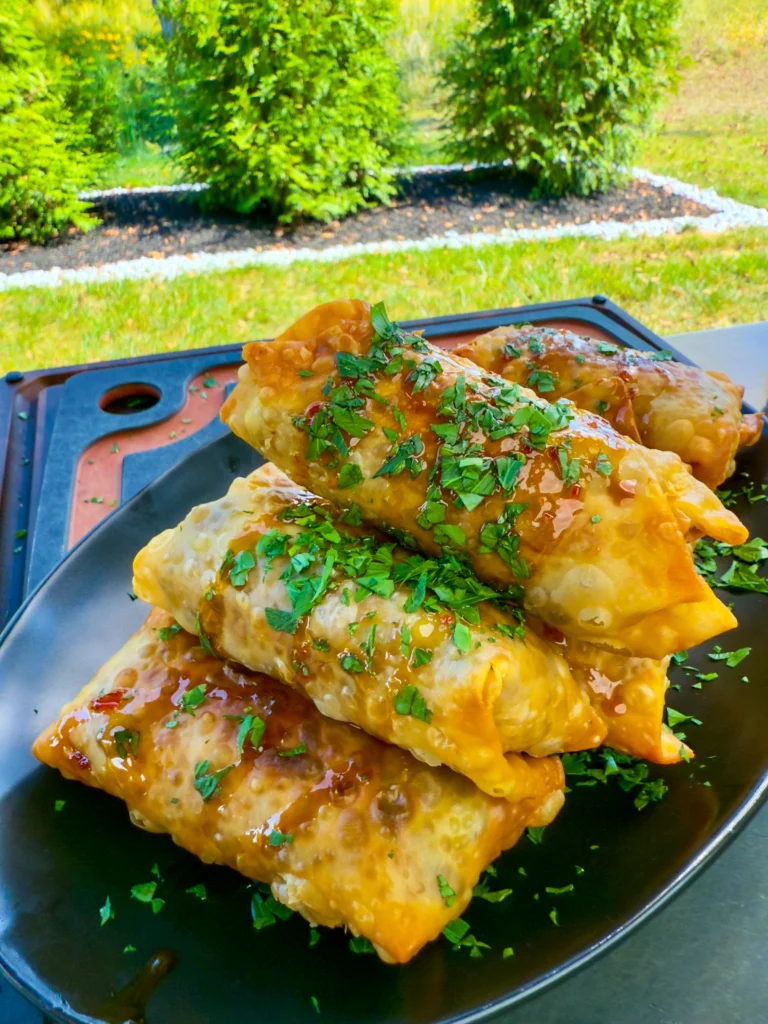 texas twinkie egg rolls on a black plate