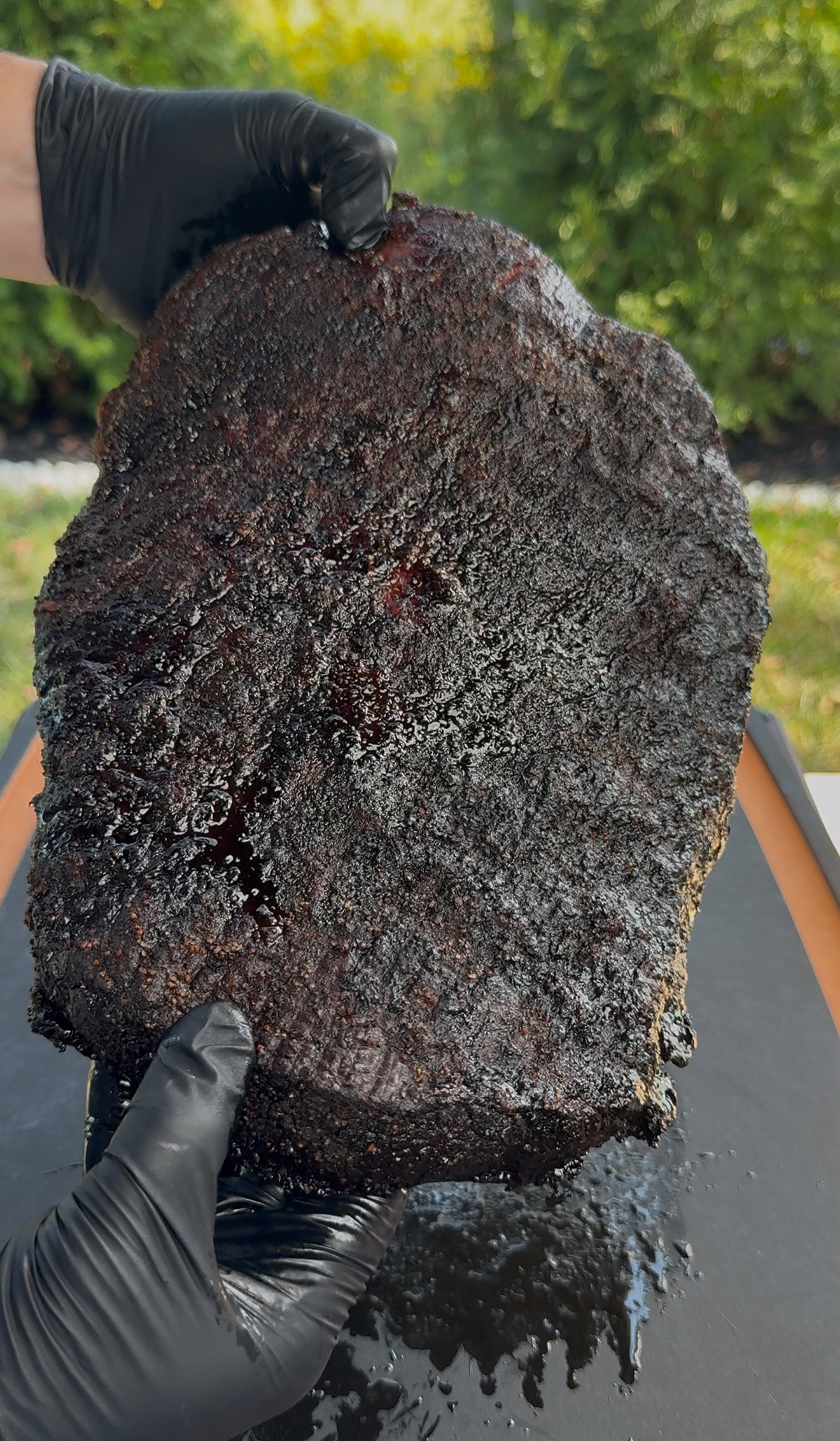 Perfect bark on a pellet smoked brisket showing deep mahogany color