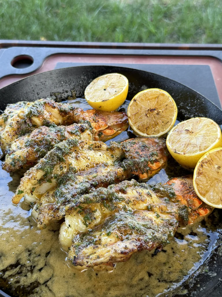 lobster tails in a cast iron