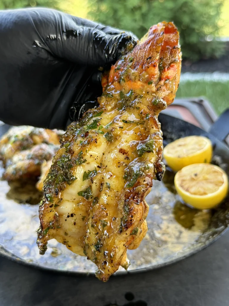 up close of a lobster tail in butter