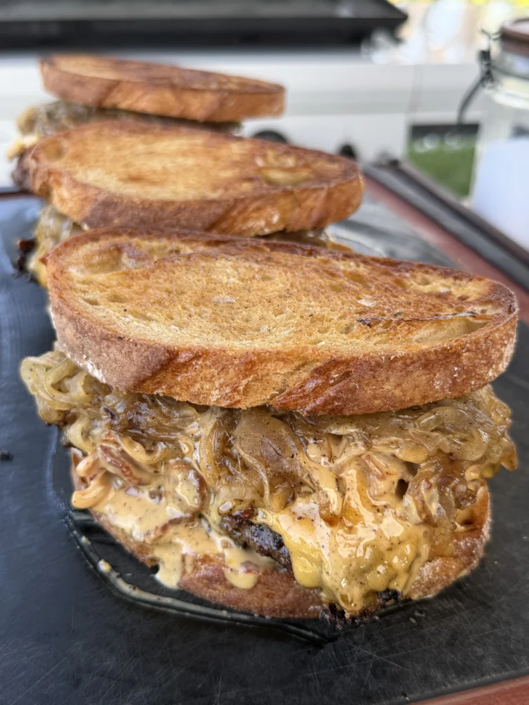 patty melt on a cutting board