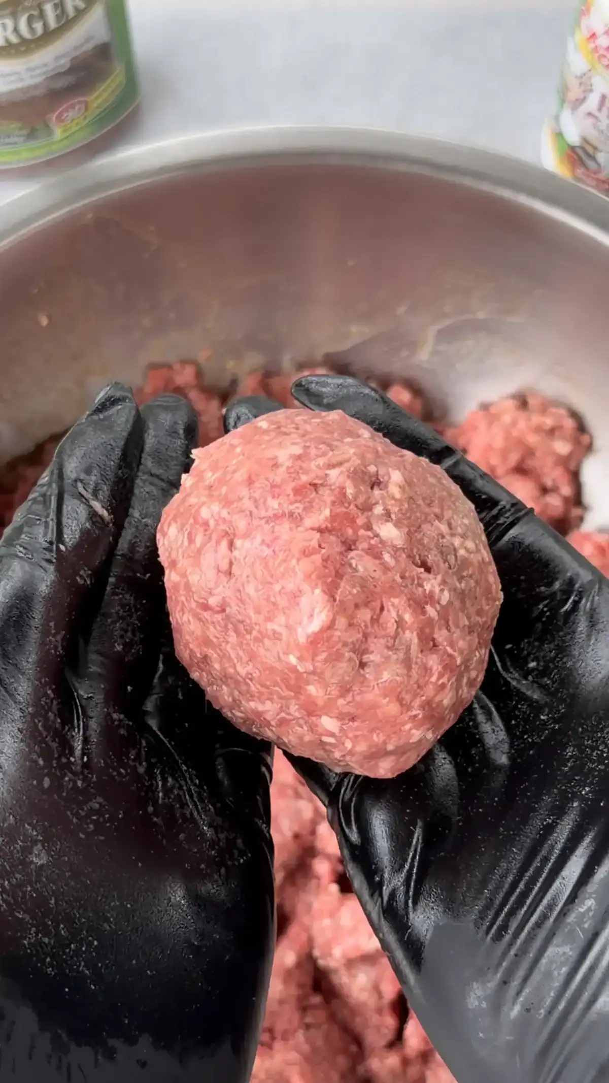 80/20 ground beef ball in a hand