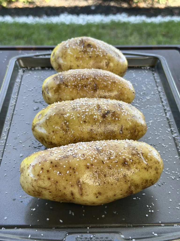 russet potatoes on a cutting board