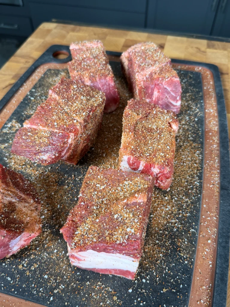chuck roast with seasoning on it