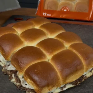 baked sliders on a cutting board
