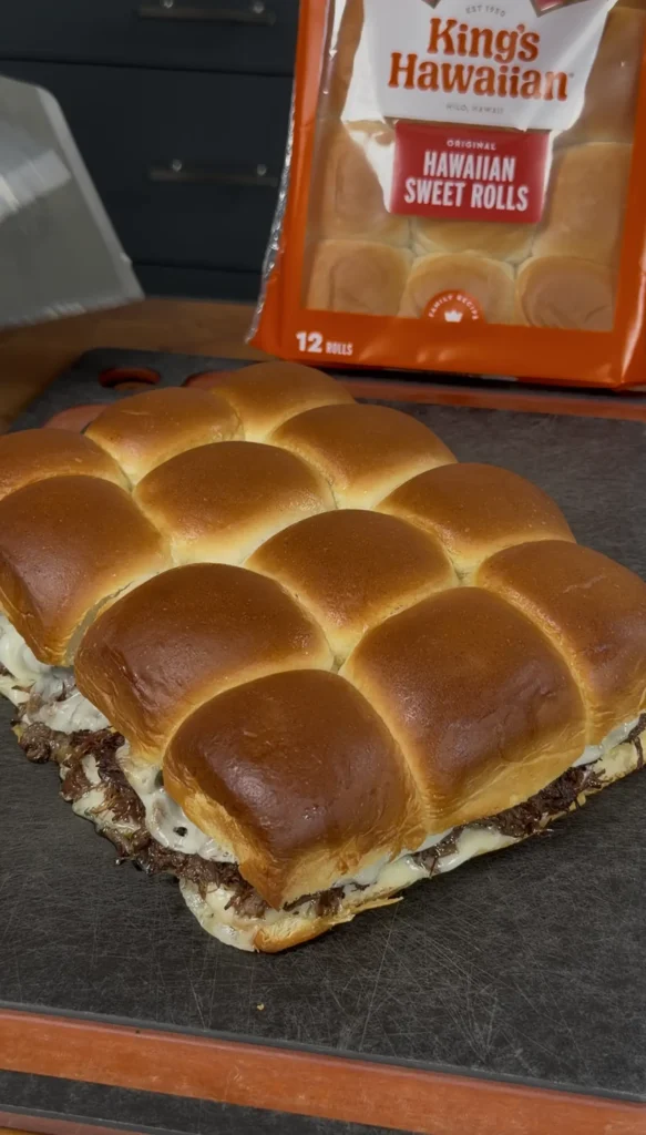 baked sliders on a cutting board