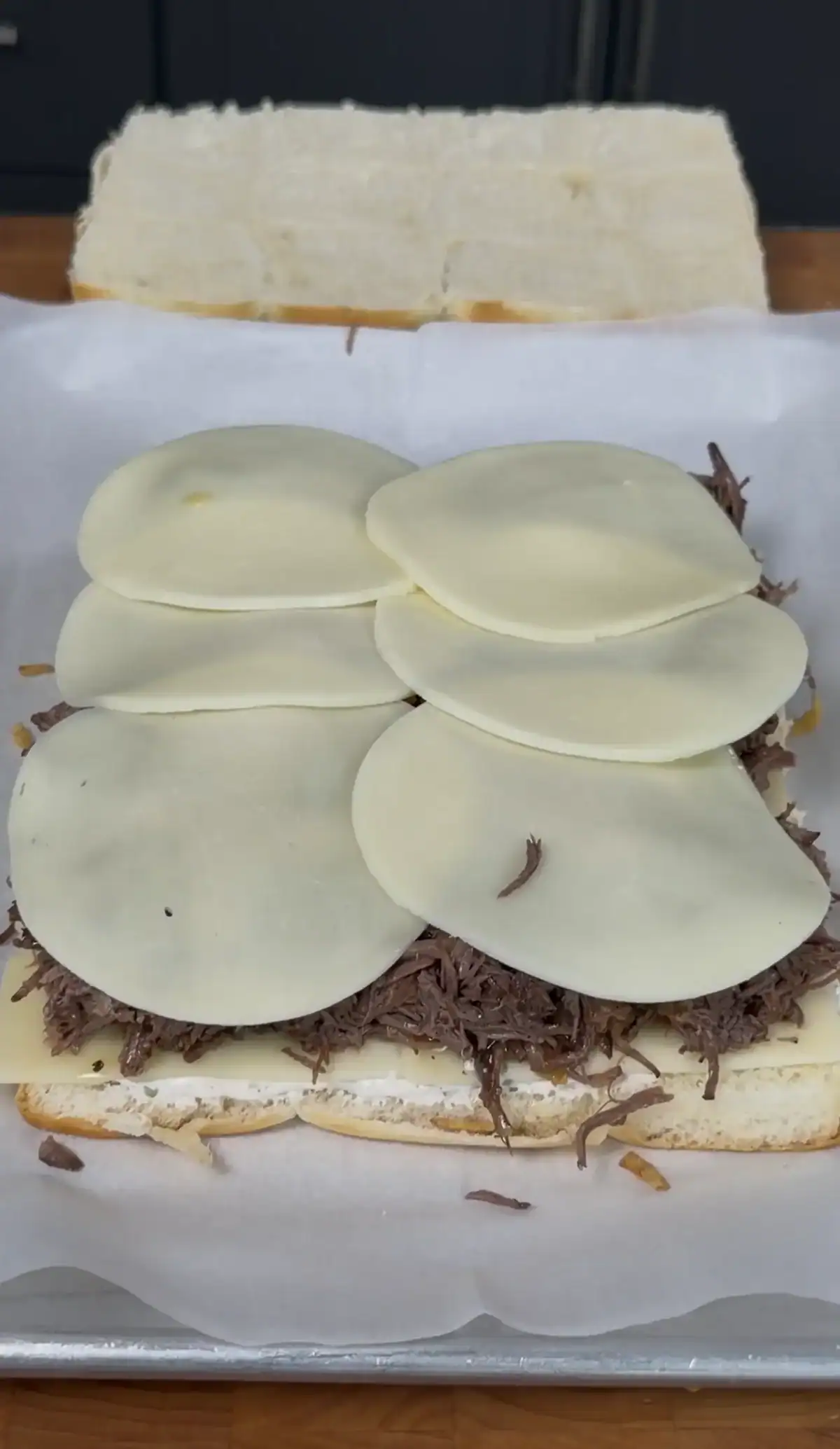 more cheese on top of the shredded beef