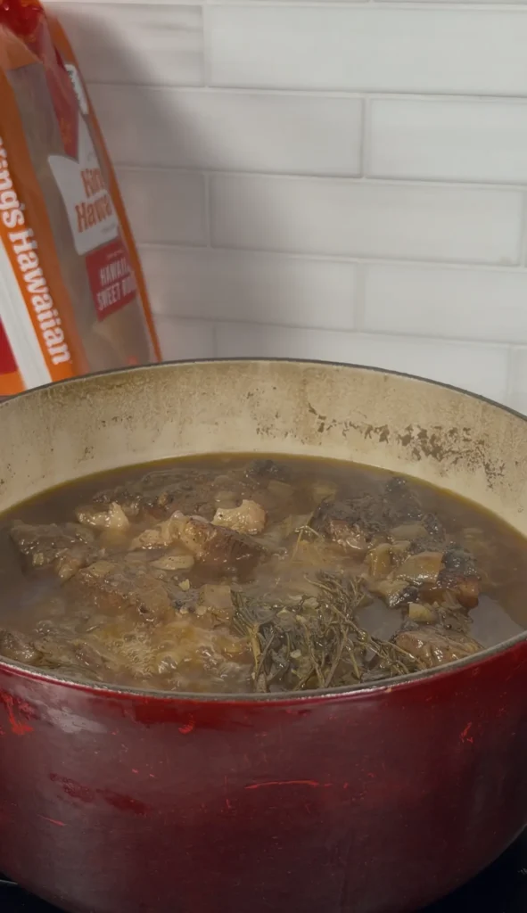 braising the beef in a dutch oven