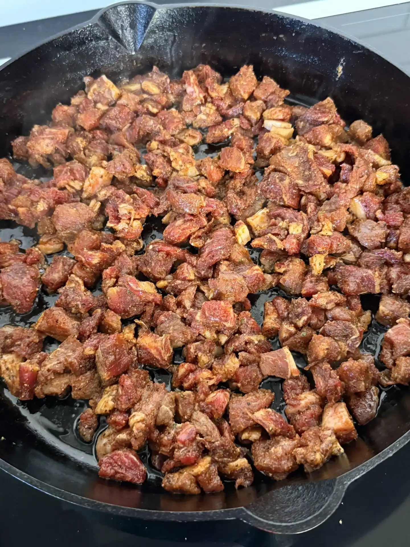 cooking ribeye steaks in the cast iron