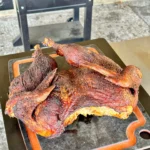 smoked turkey on a cutting board