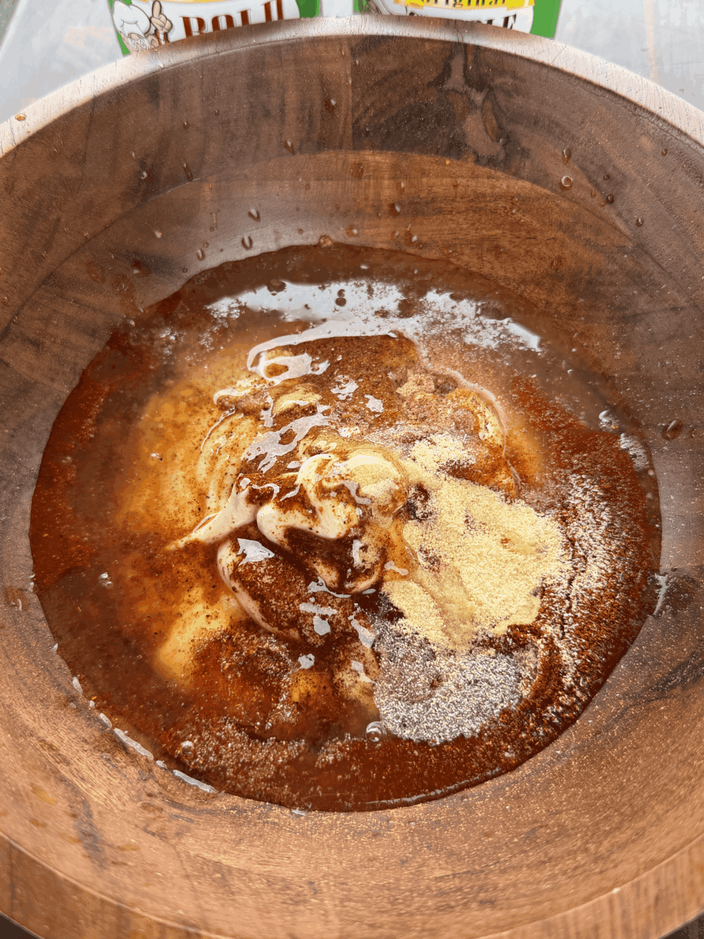 creamy sauce in a wooden bowl
