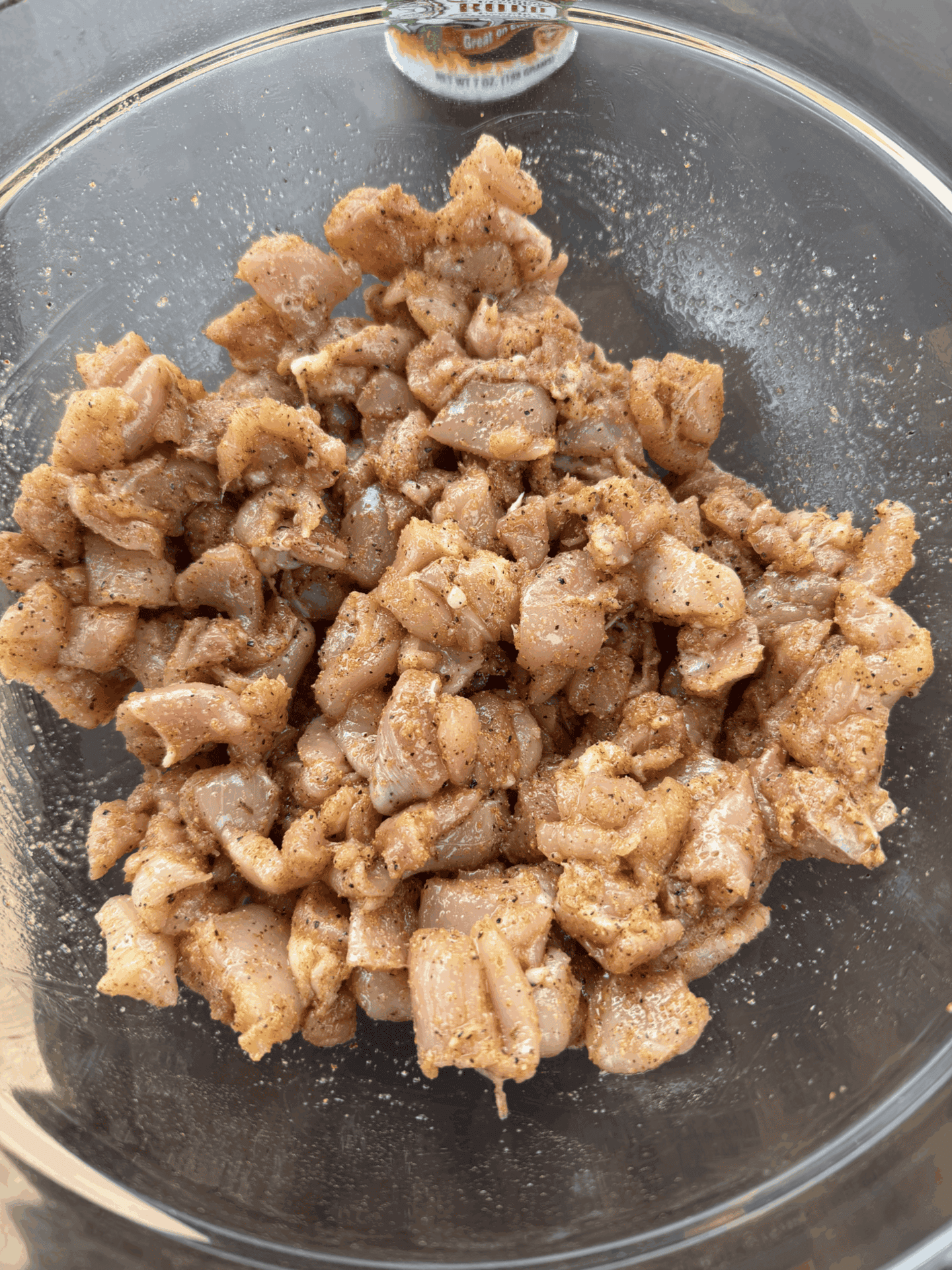 seasoned chicken thighs in a bowl
