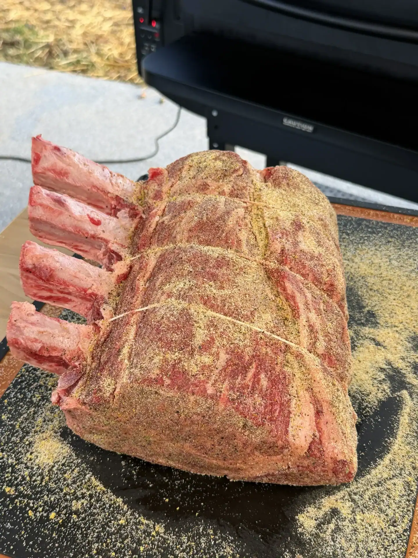 seasoned prime rib on the cutting board