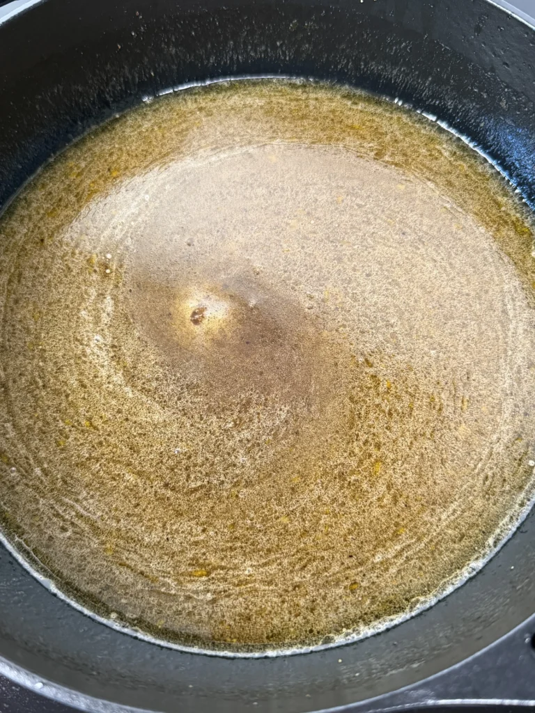 maple bourbon glaze in a black bowl