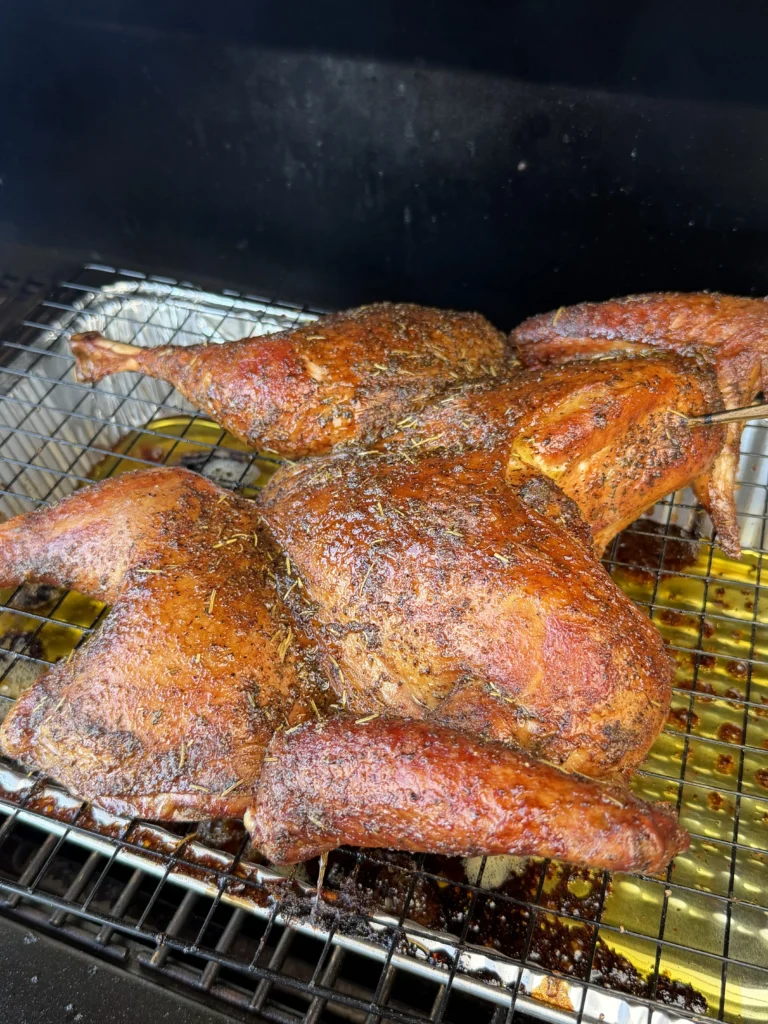 close up of turkey in the smoker