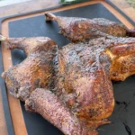smoked turkey on a cutting board
