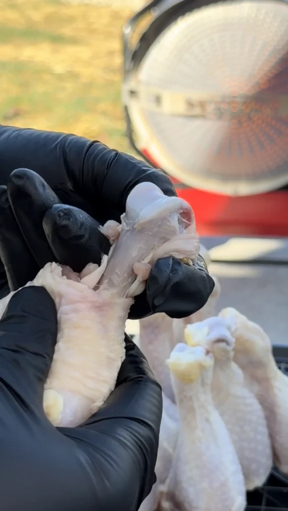 trimming the edges of the chicken lollipop