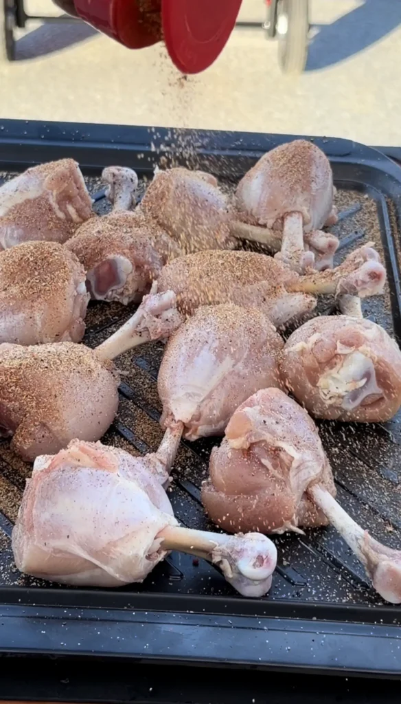 seasoned chicken lollipops on a cutting board