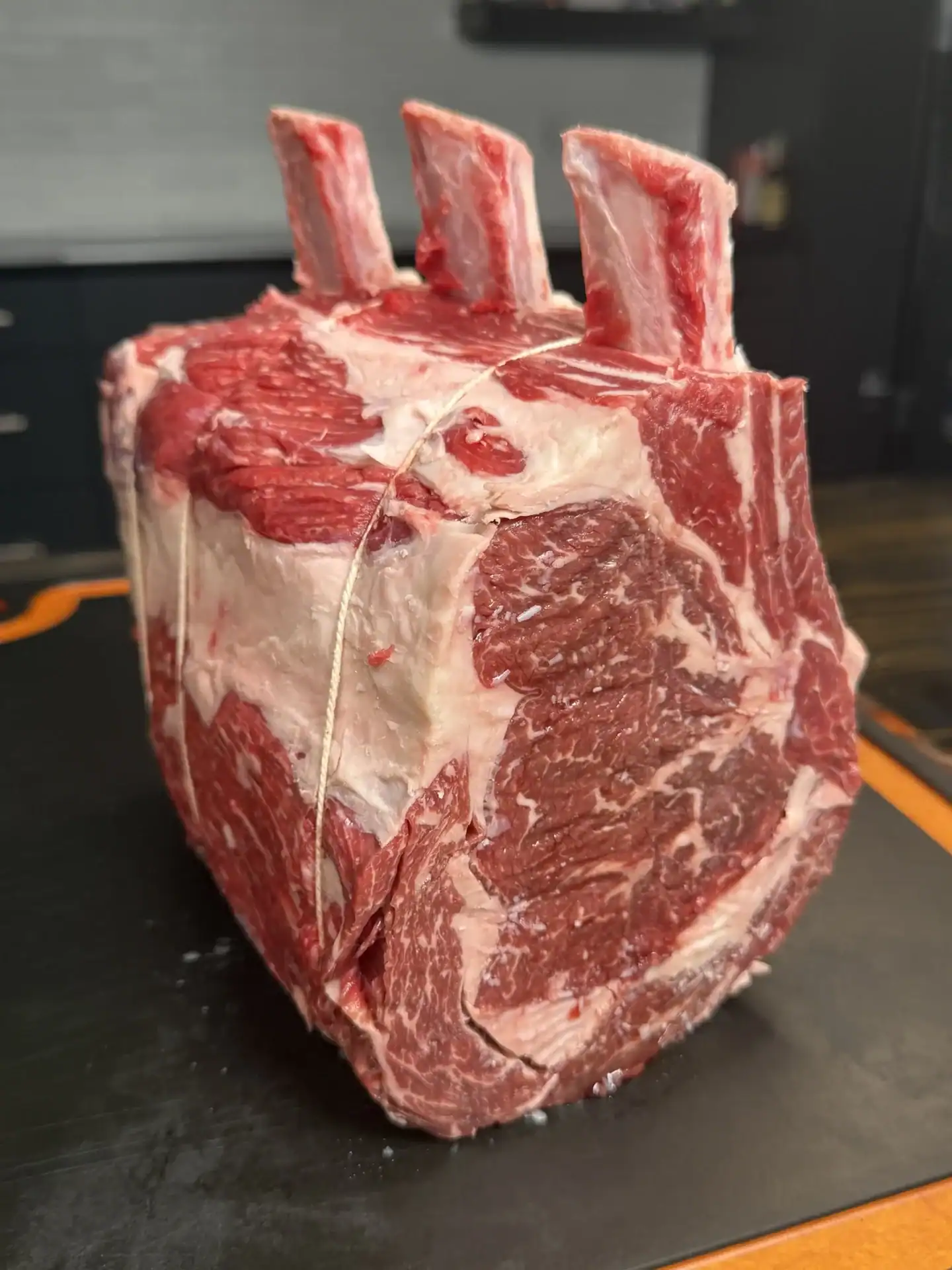 bone in prime rib on the cutting board