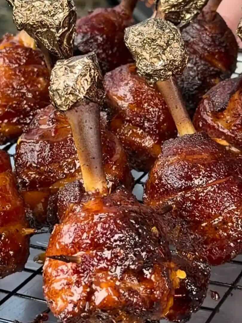 Bacon wrapped chicken lollipops with sweet chili garlic glaze