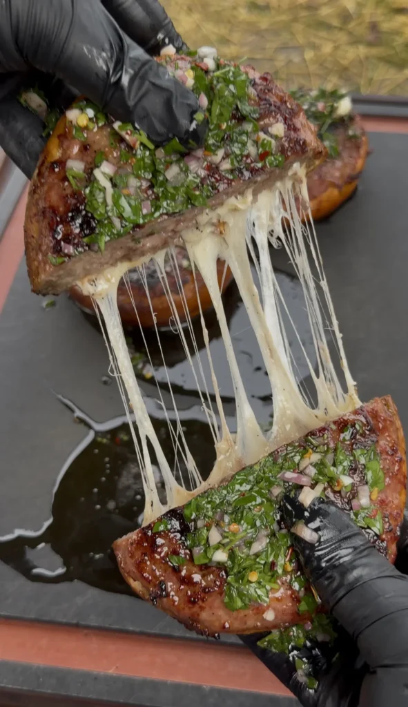 sausage stuffed bread recipe being pulled apart
