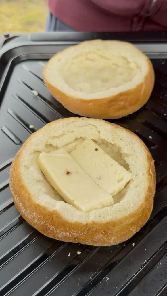 cheese in the hollowed out bread