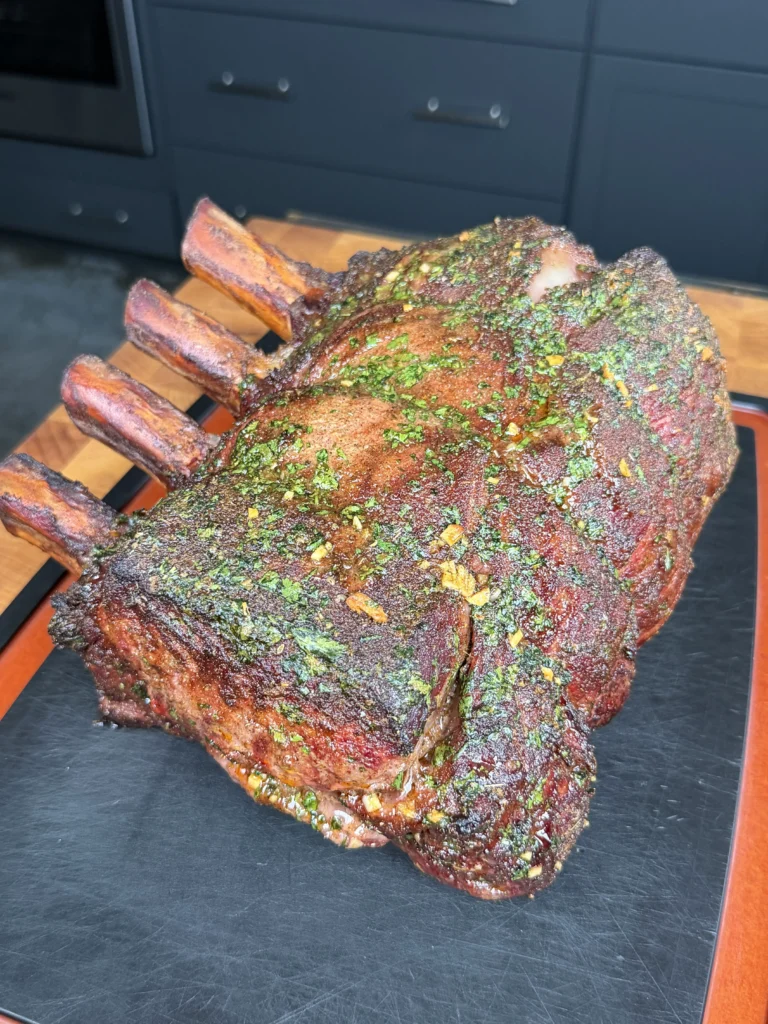seasoned and smoked prime rib on a cutting board