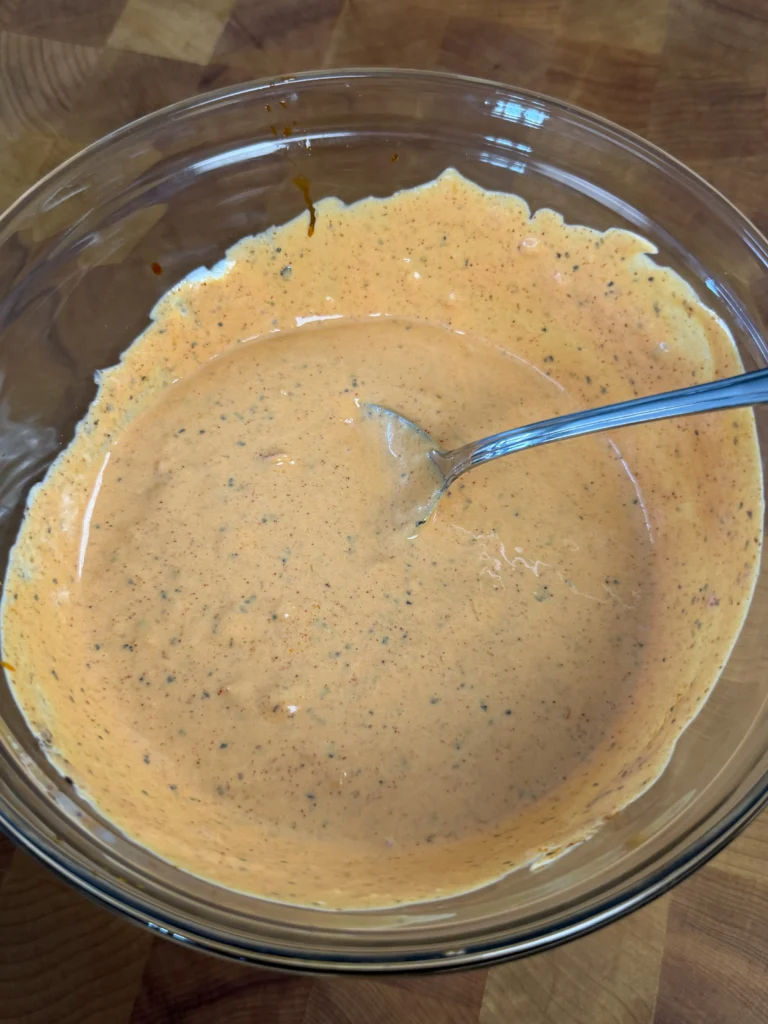 garlic parmesan butter being whisked 