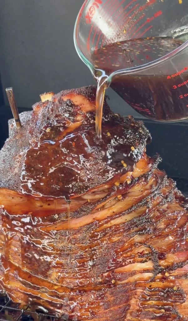 glazed christmas ham in a metal pan