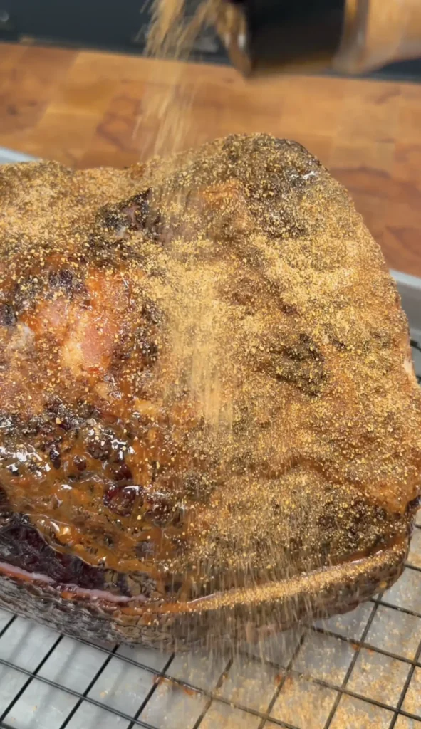 seasoned ham on a wire rack