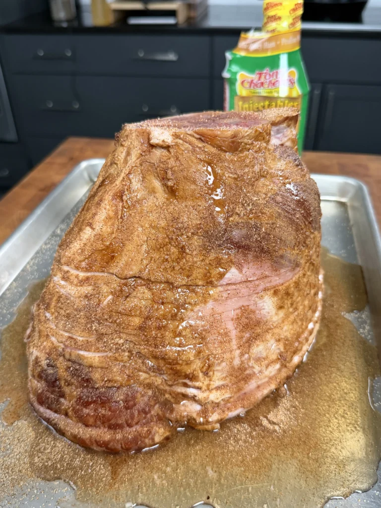 seasoned ham on a metal tray