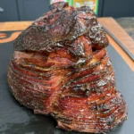 perfectly smoked ham on a cutting board
