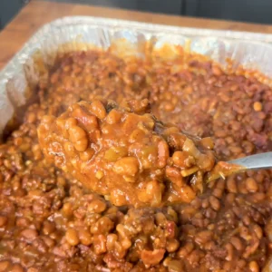 up close on the baked beans in a metal pan